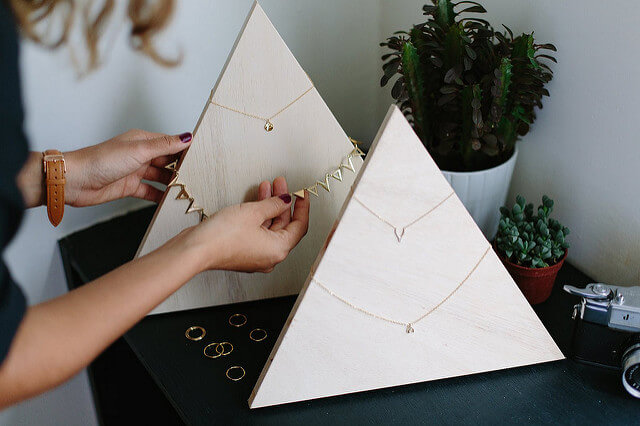 Triangular wooden stand