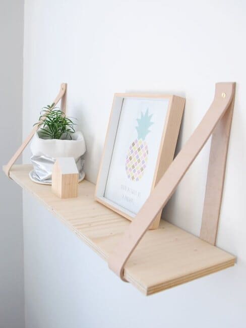 Wooden shelf and leather strips